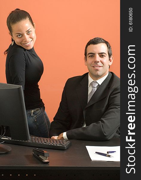 Businessman and woman working in an office. Businessman and woman working in an office.