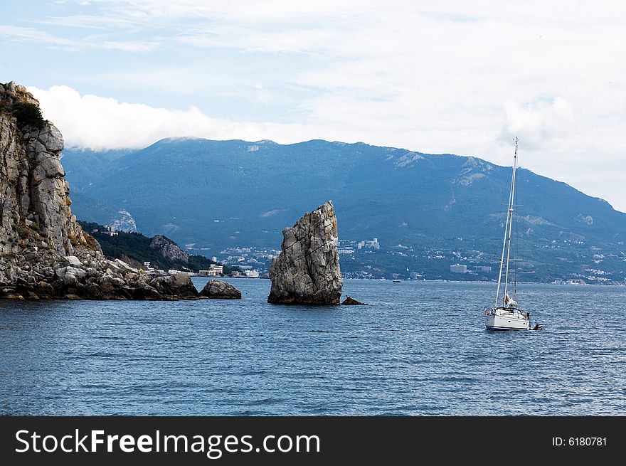 An image of white yacht in sea