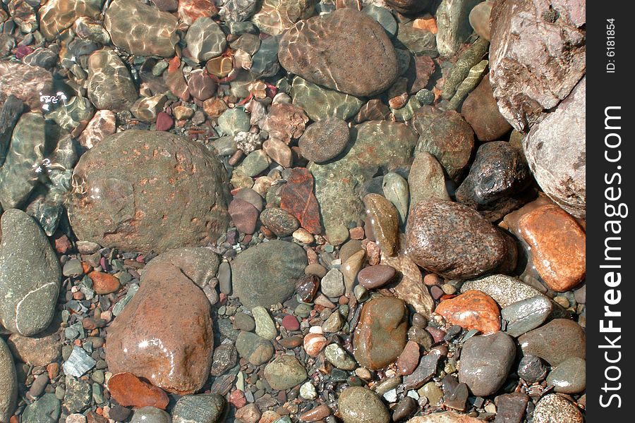 Background with stones under current water. Background with stones under current water.
