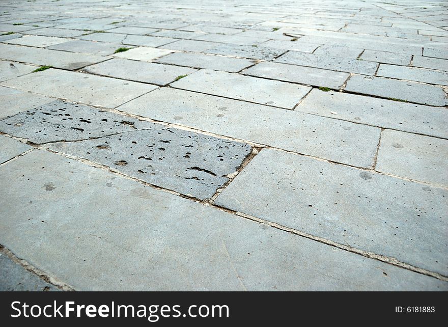 Close-up of new old-style pavement of bricks of grey color