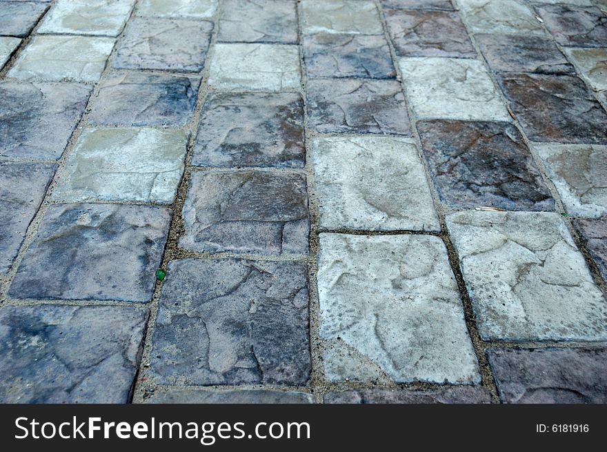 Close-up of new old-style pavement of bricks of grey color