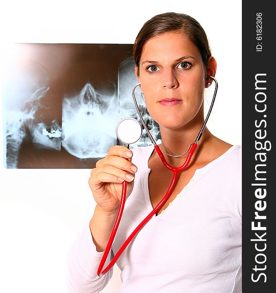 A beautiful young doctor with a red stethoscope and a xray image in the back. Isolated over white. A beautiful young doctor with a red stethoscope and a xray image in the back. Isolated over white.