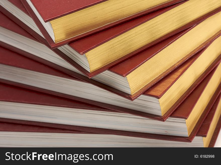 Burgundy Covered Stack of Books Close Up.