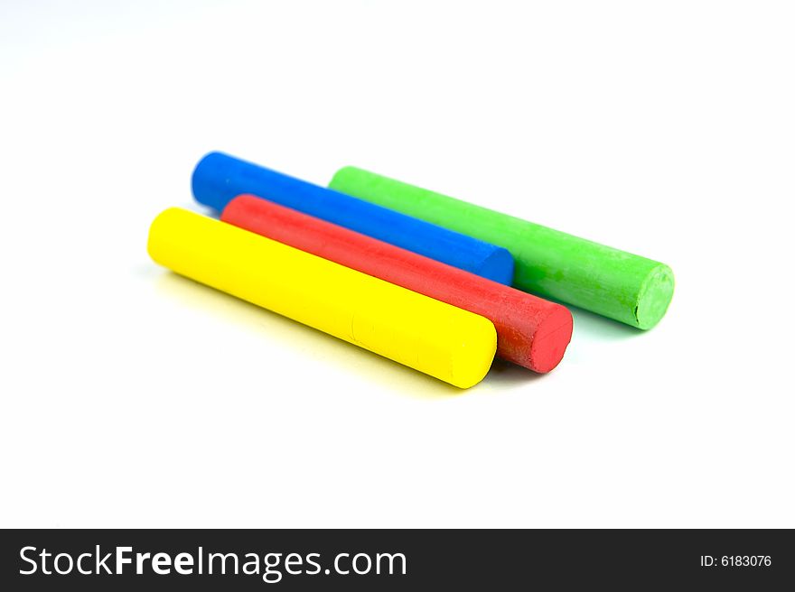 Oil pastels/crayons isolated against a white background