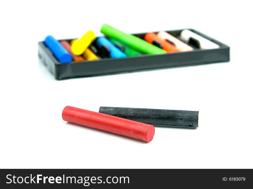 Oil pastels/crayons isolated against a white background