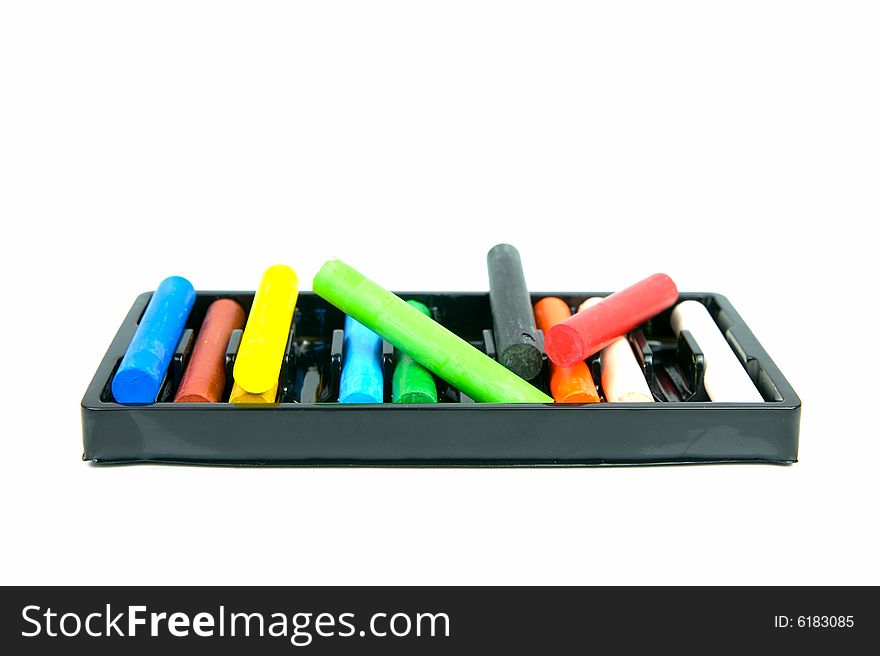 Oil pastels/crayons isolated against a white background