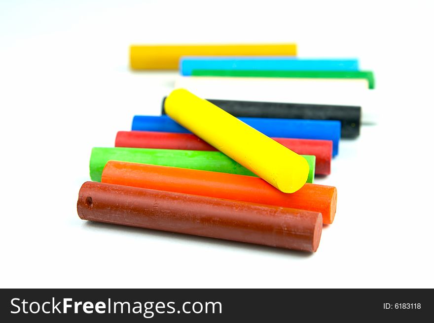 Oil pastels/crayons isolated against a white background