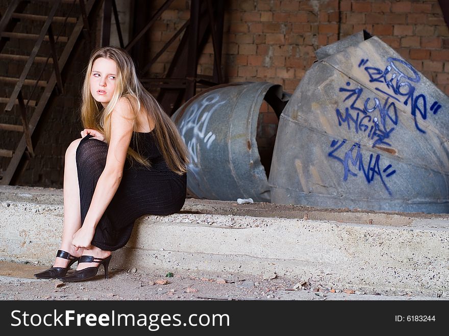 Beautiful grungy girl posing at graffiti wall. Beautiful grungy girl posing at graffiti wall