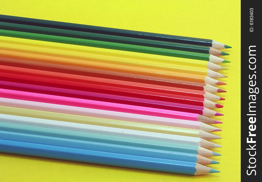 Crayons on the yellow background