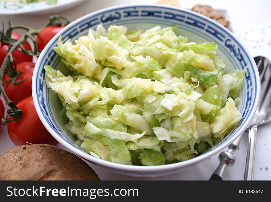 A fresh salad of potatoes and vegetables