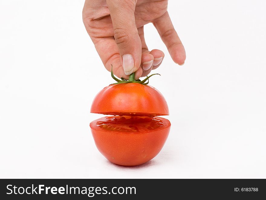 Cut tomato on a white background