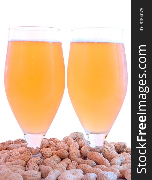 Beer in glass  and  snack - peanuts  in shells. Beer in glass  and  snack - peanuts  in shells.