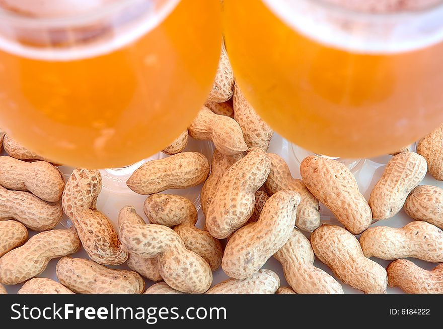 Beer In Glass  And Peanuts  In Shells.