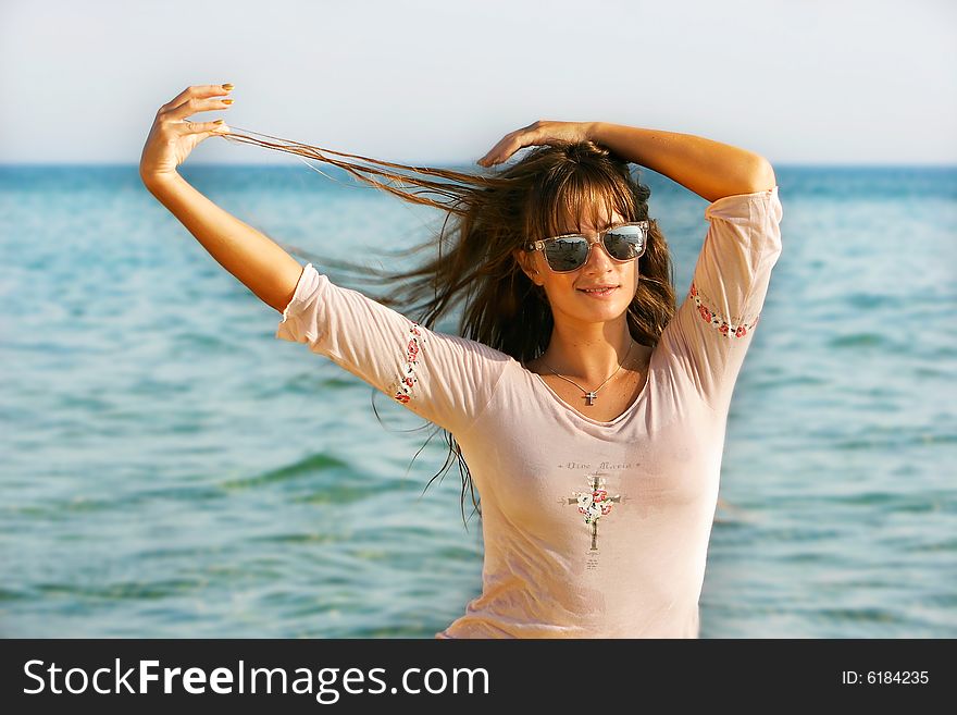 Young girl at sea background