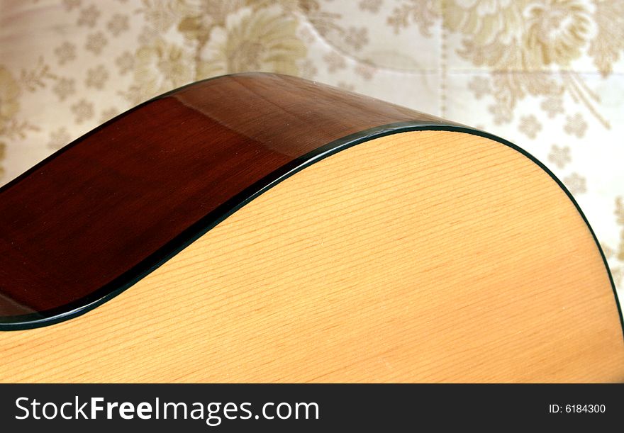 Classical guitar detail on floral background. Classical guitar detail on floral background