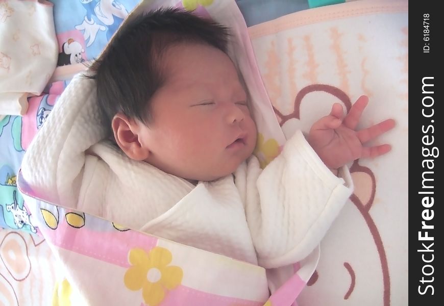 Sleeping Baby on a bed