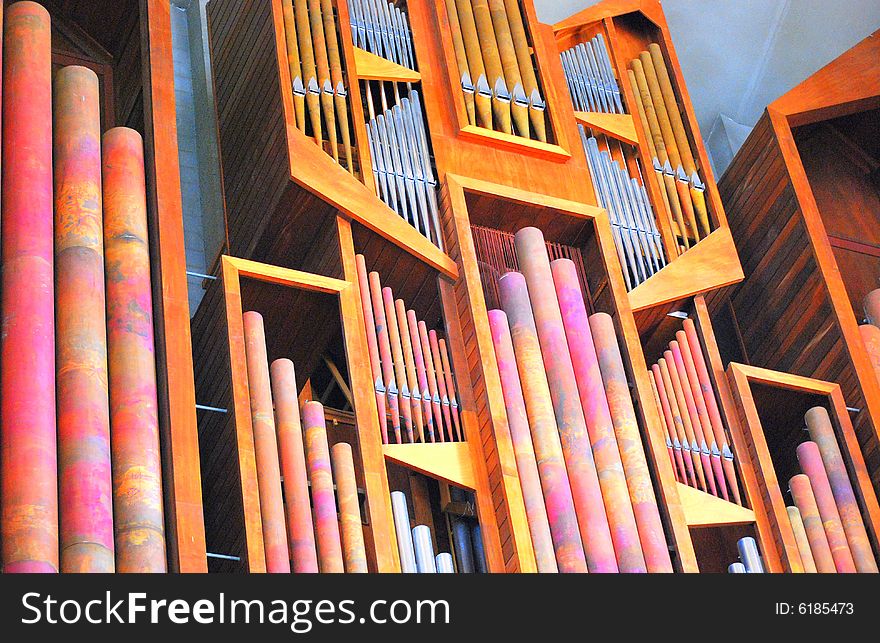 Pipe organ located inside a church.