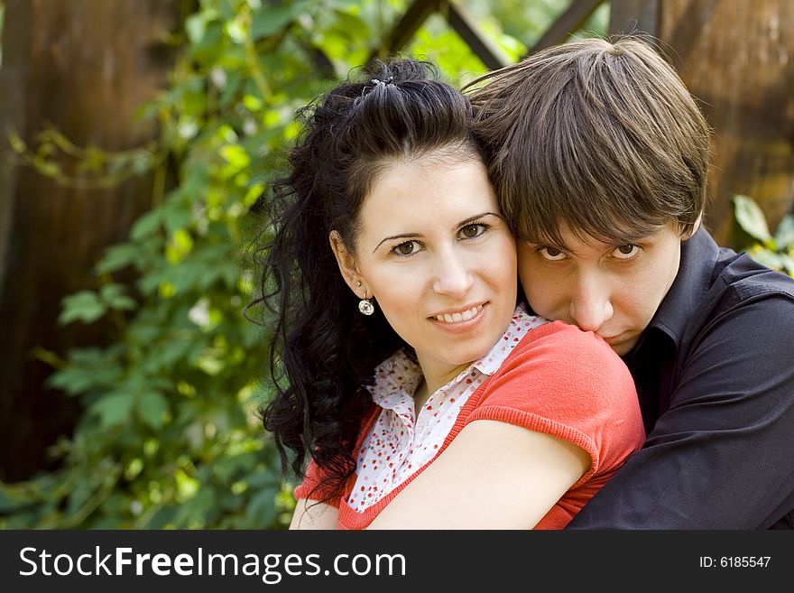 Outdoor portrait of young happy attractive couple together