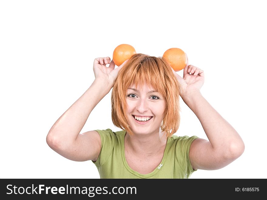 The young woman with red hair holds two oranges