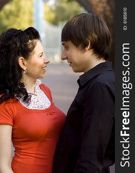 Outdoor portrait of young happy attractive couple together