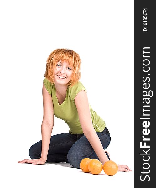 The woman  on a white background with oranges. The woman  on a white background with oranges