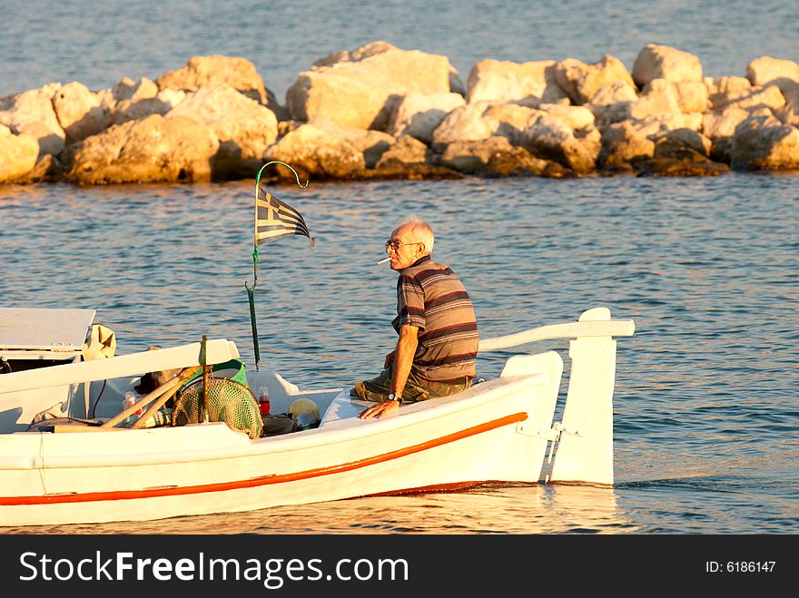 Old boatman in the sunset