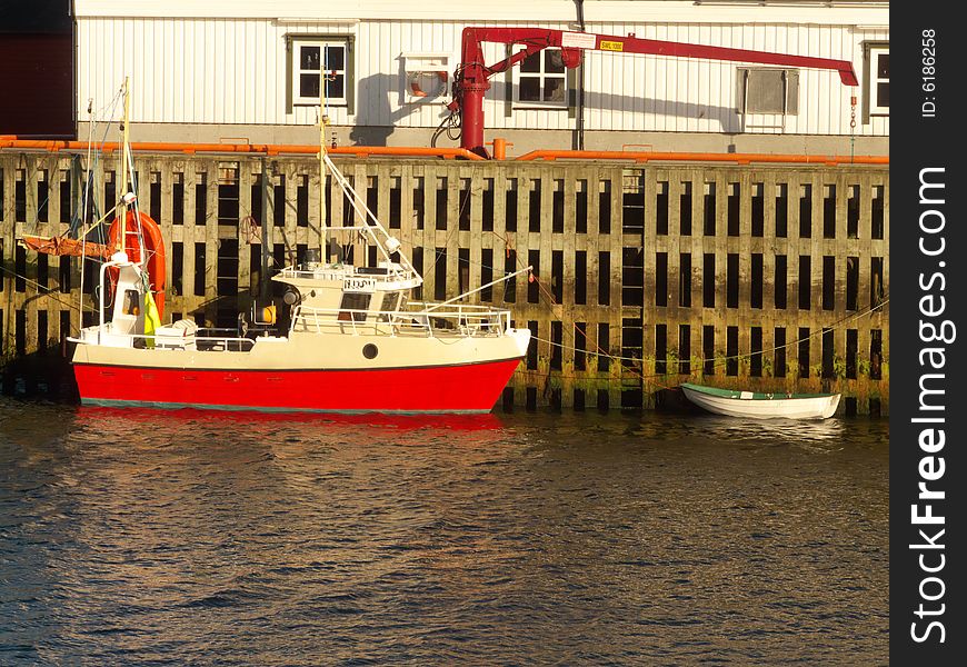 Small cod fishing boat Henningsvaer docks Lofoten islands, norwegian arctic sea. Small cod fishing boat Henningsvaer docks Lofoten islands, norwegian arctic sea