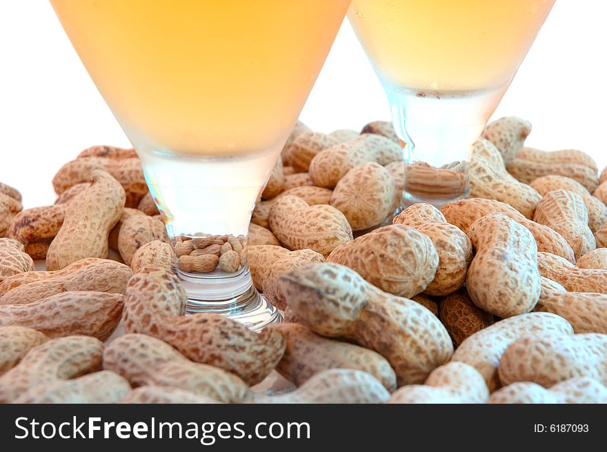 Beer in glass  and  snack - peanuts  in shells. Beer in glass  and  snack - peanuts  in shells.