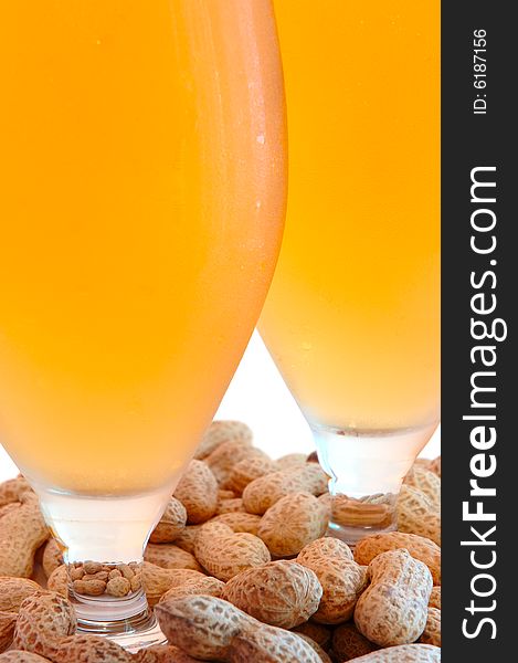 Beer in glass  and  snack - peanuts  in shells. Beer in glass  and  snack - peanuts  in shells.