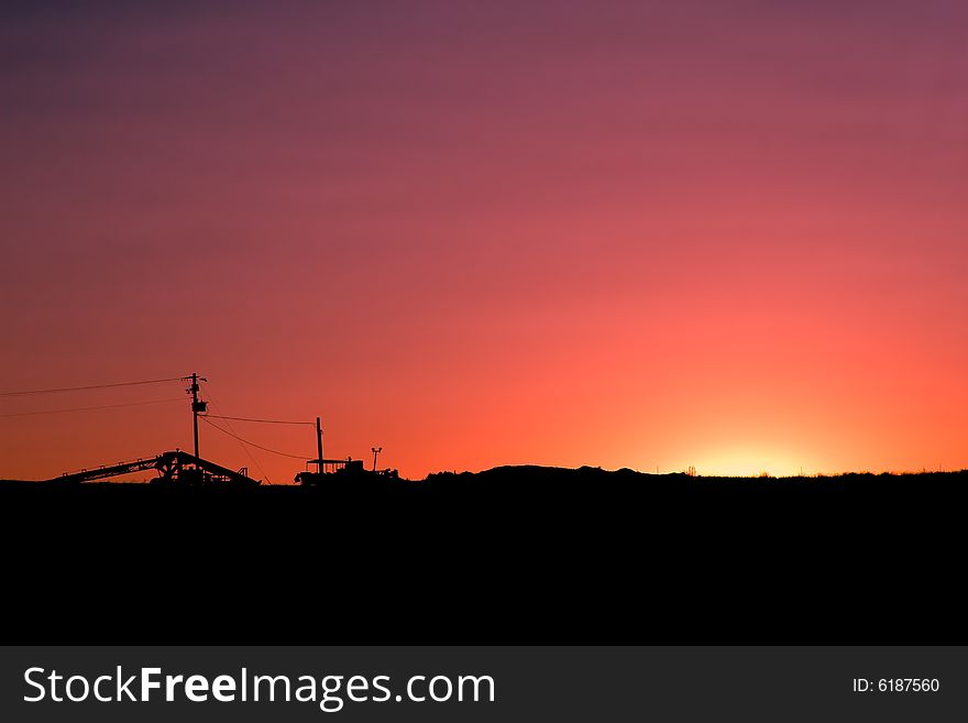 Sunset backlighting and silhouetting a rural landscape. Sunset backlighting and silhouetting a rural landscape.