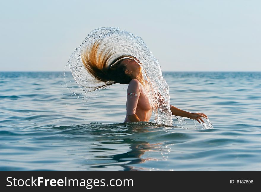Girl with long hair in the sea. Girl with long hair in the sea