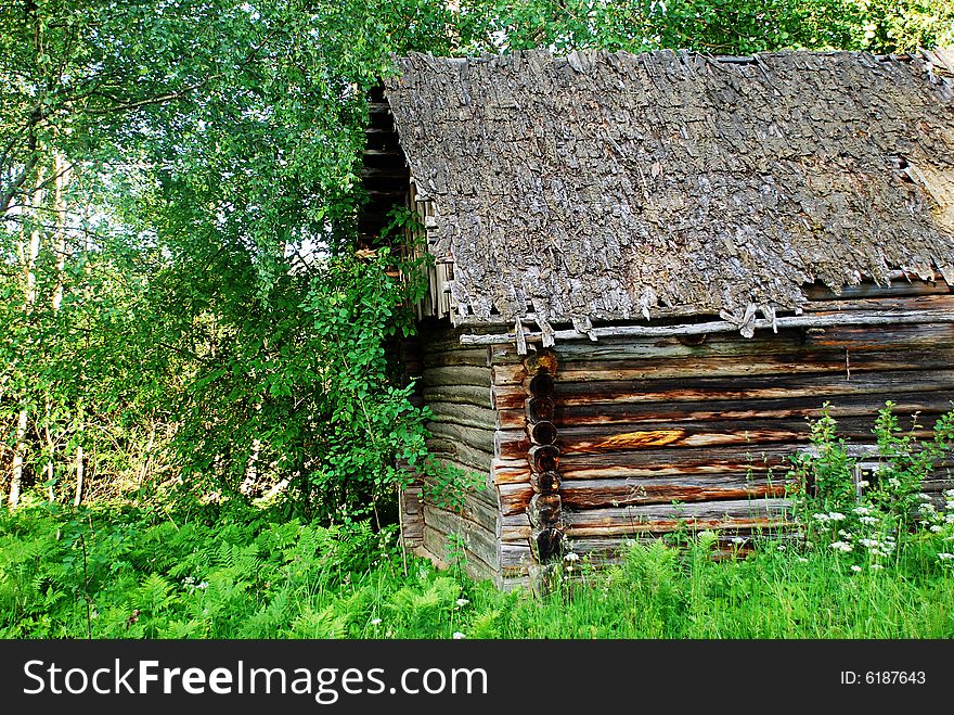 An old log bathhouse out in the country