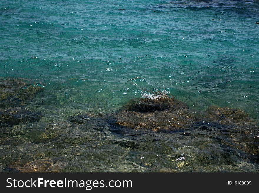 Turquoise water over sand and stones from sandstone. Turquoise water over sand and stones from sandstone