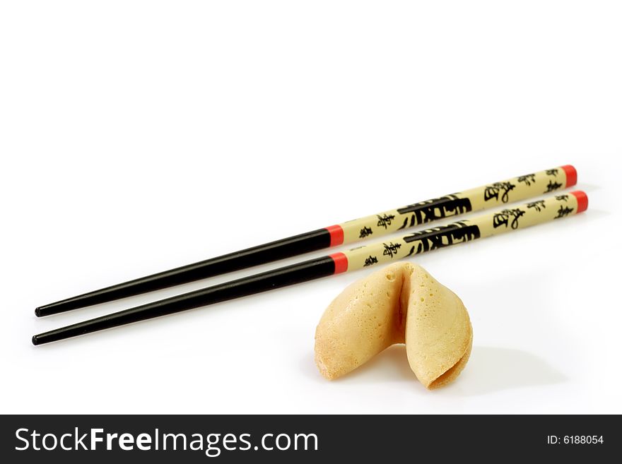 Fortune Cookie with Chopsticks on bright Background. Fortune Cookie with Chopsticks on bright Background