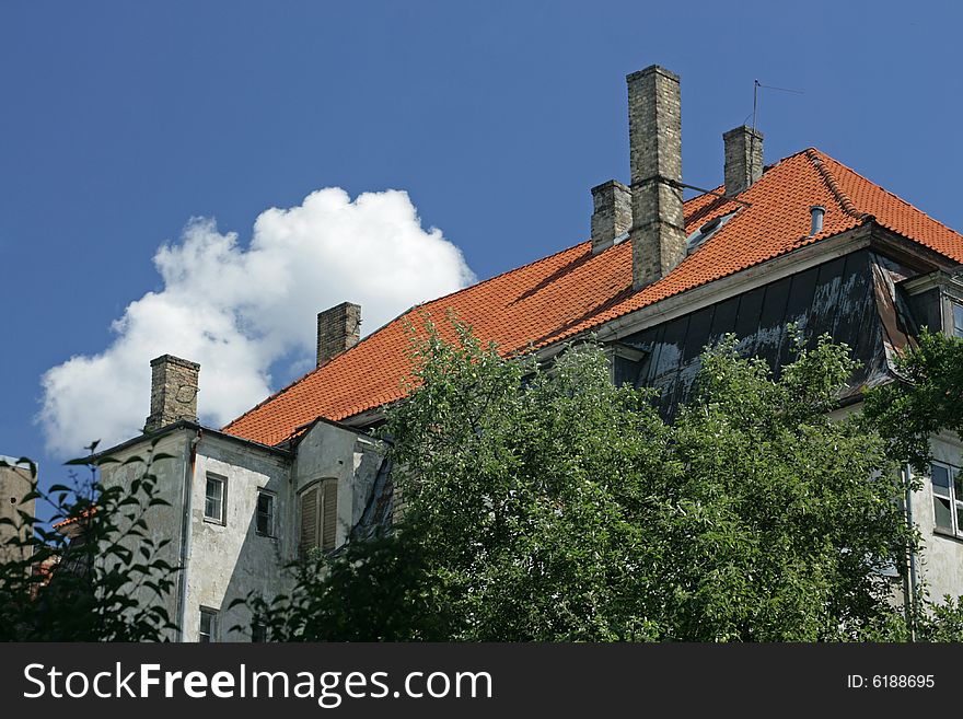 Tiled roof of an old house. Tiled roof of an old house