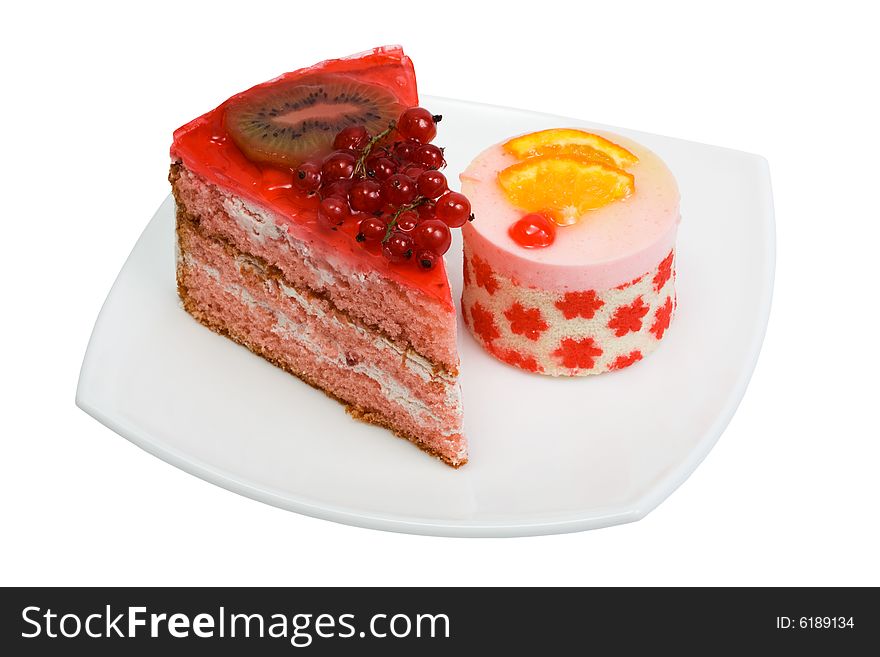 Sweet cakes with fruit on a white background