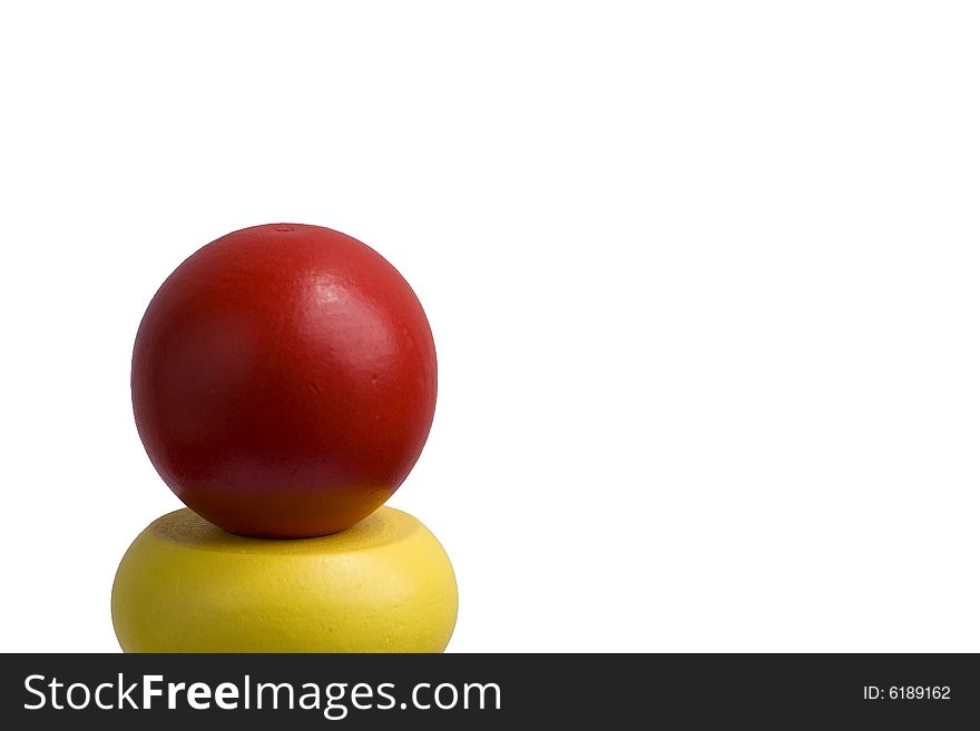 Detail of stacking wooden rings toy on white background