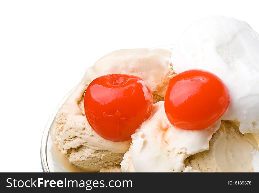 Ice-cream with a cherry in a glass on a white background. Ice-cream with a cherry in a glass on a white background.