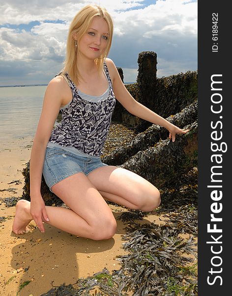 Cute young blond lady on beach