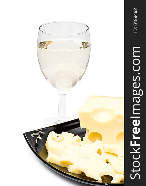 Wine in a glass  and cheese on a white background. Wine in a glass  and cheese on a white background