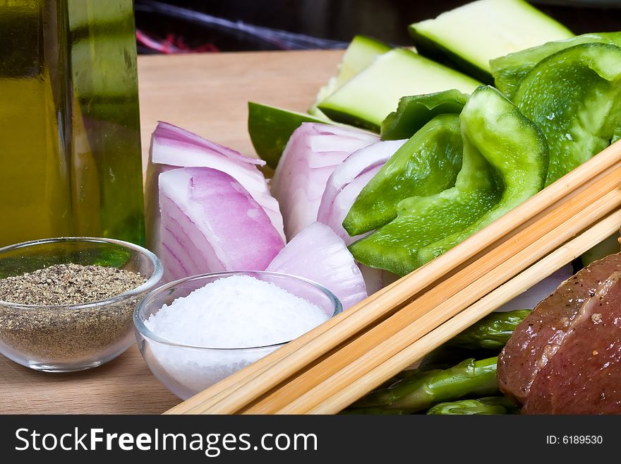 Getting ready to make shish kabobs raw meat and vegetables. Getting ready to make shish kabobs raw meat and vegetables