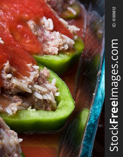 Stuffed peppers cut in to slices with tomato sauce