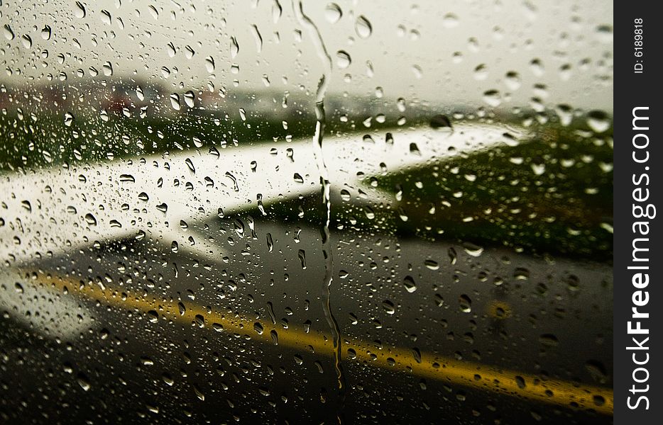 A view from airplane's window trough raindrops