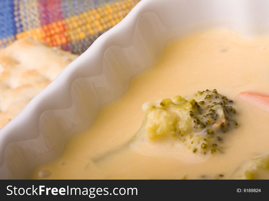 Cream of broccoli soup on a blue placemet. Cream of broccoli soup on a blue placemet