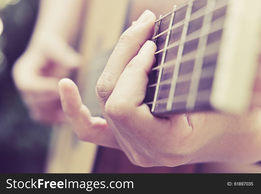 Close up image of Man playing his acoustic guitar Background. Close up image of Man playing his acoustic guitar Background