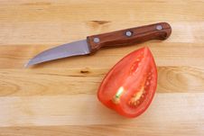 Fresh Tomato With Knife Royalty Free Stock Photos