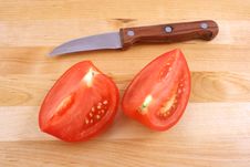 Fresh Tomato With Knife Royalty Free Stock Photo