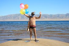 Man With Mask, Flippers And Balloons Is Salutation Stock Image Man With Mask, Flippers And Balloons Is Salutation Stock Image