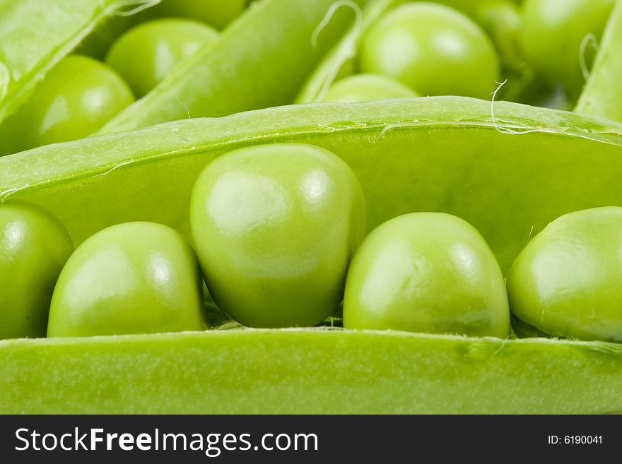 Fresh pods of peas on a white background. Fresh pods of peas on a white background