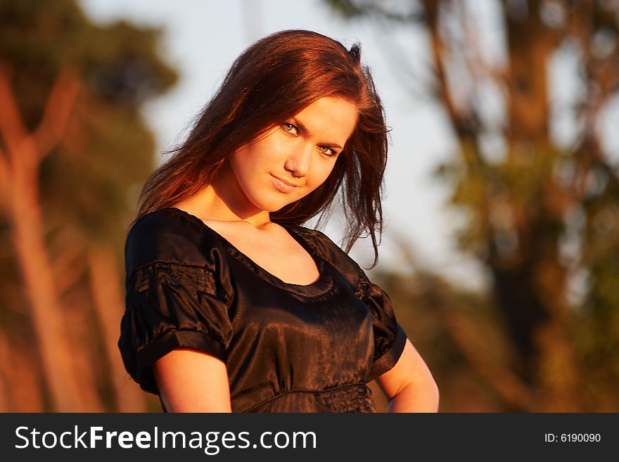 Portrait of a young lady in light of the evening sun